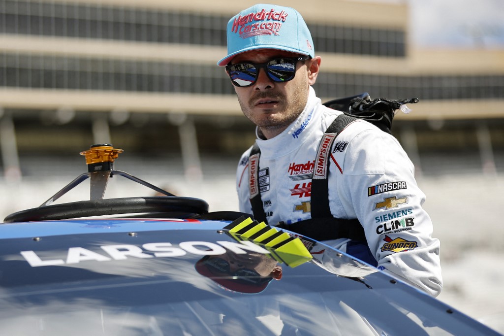 Kyle Larson, driver of the HendrickCars.com Chevrolet, enters his car during qualifying for the NASCAR Cup Series Ambetter Health 400 as we look at our Pennzoil 400 odds and predictions.