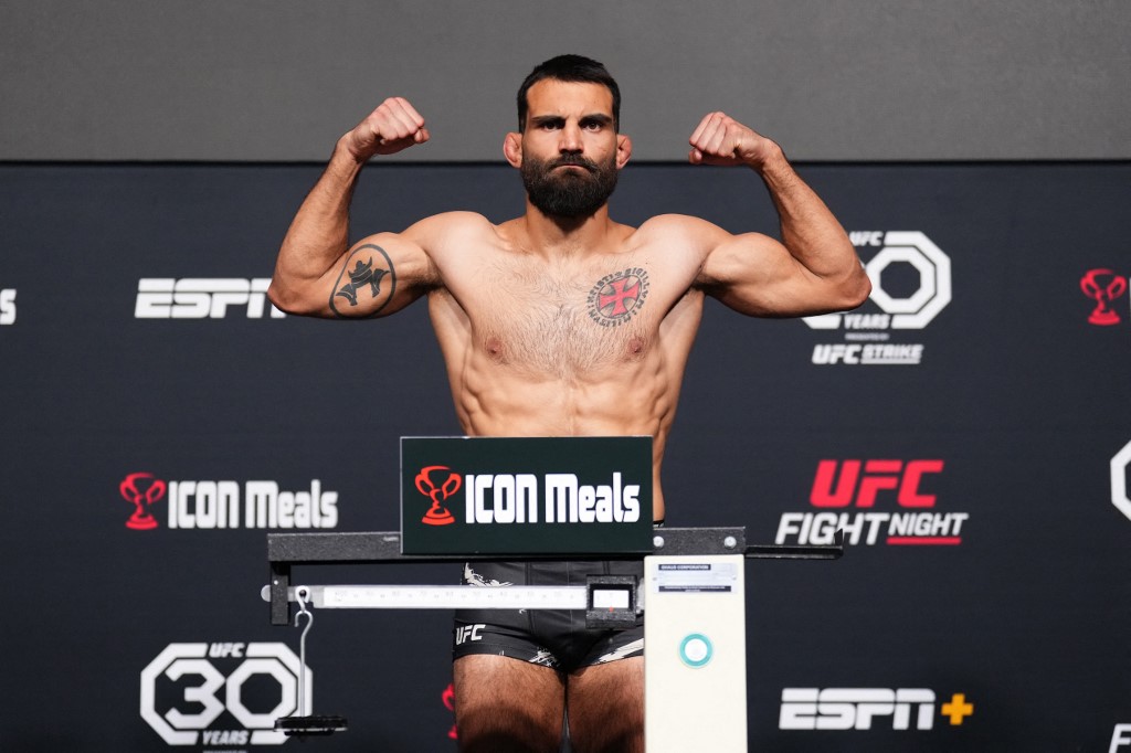 Benoit Saint Denis of France poses on the scale as we look at the best FanDuel promo codes for UFC 299