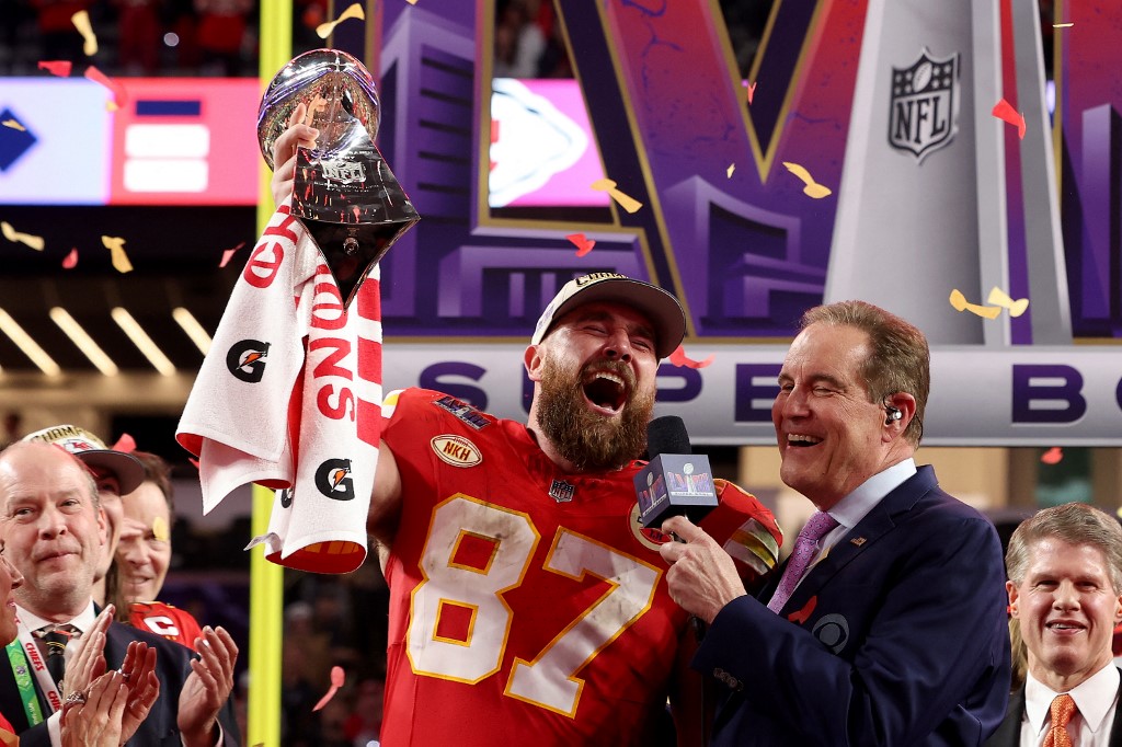 Travis Kelce of the Kansas City Chiefs reacts as he holds the Lombardi Trophy after defeating the San Francisco 49ers during Super Bowl LVIII as we look at the Super Bowl success of sportsbooks in Nevada.