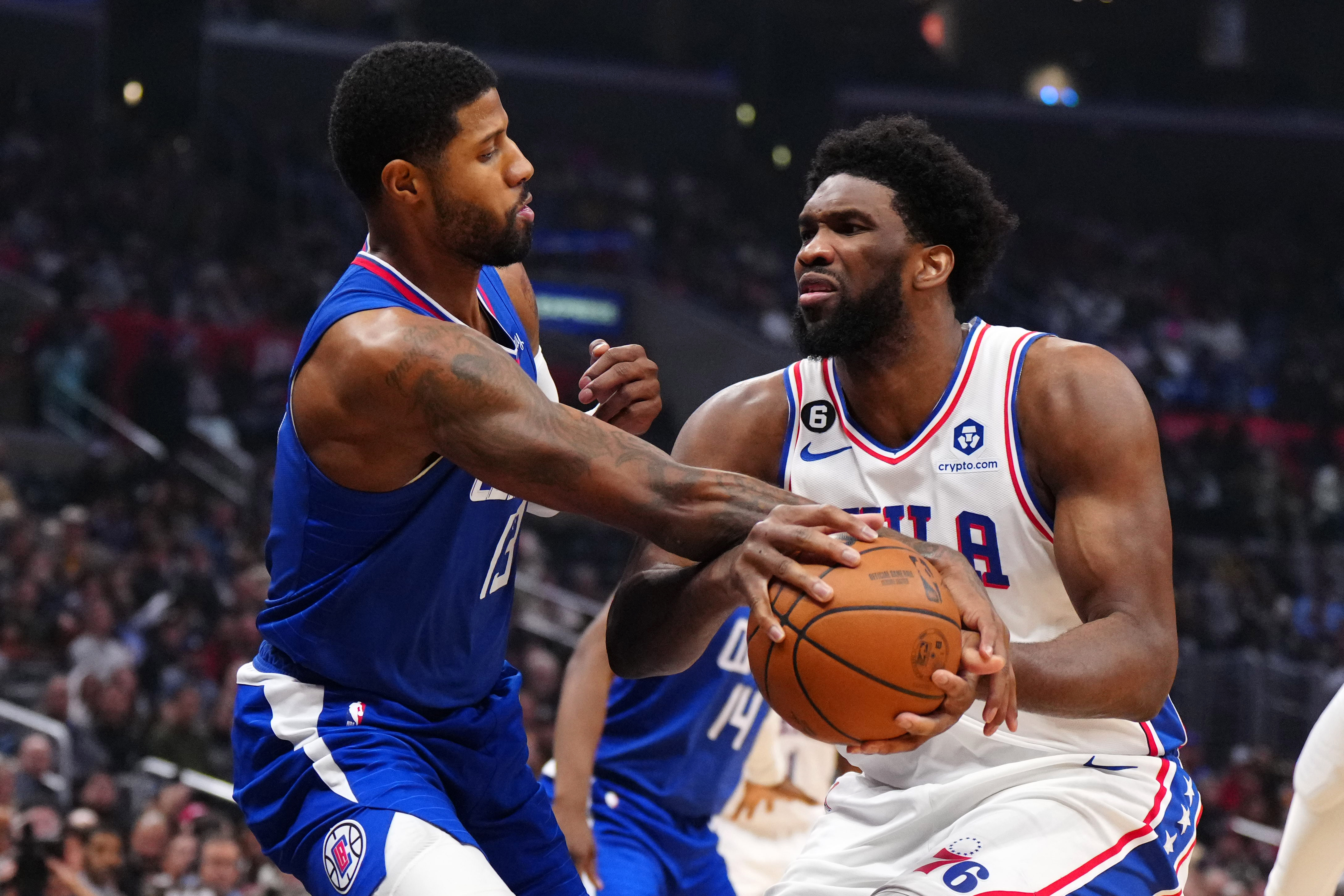 Philadelphia 76ers center Joel Embiid (21) is fouled by LA Clippers guard Paul George (13) as we examine the latest NBA championship odds with the Boston Celtics the favorites over the Philadelphia 76ers.