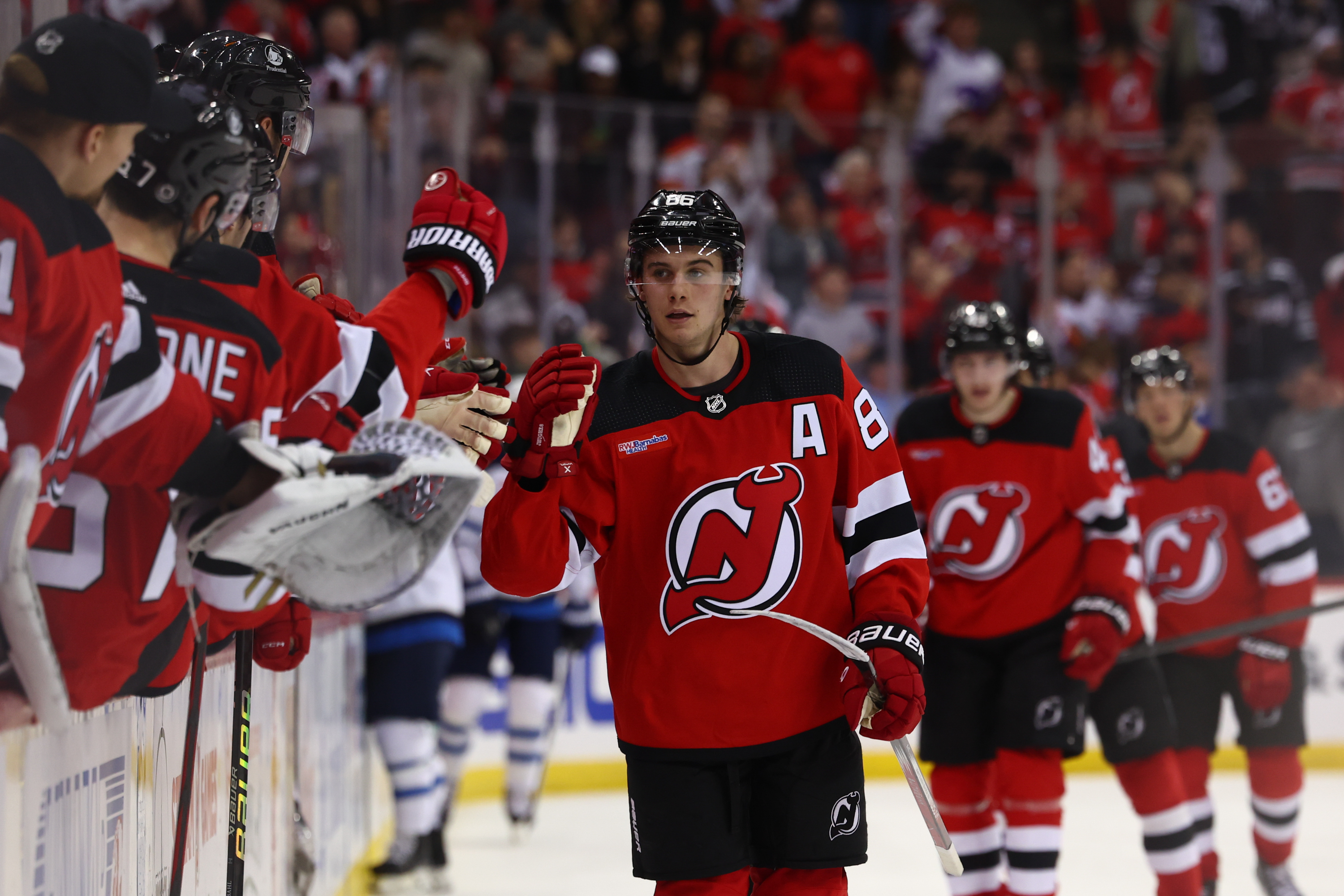 New Jersey Devils center Jack Hughes celebrates his goal against the Winnipeg Jets during the third period at Prudential Center as we look at Prophet Exchange leaving New Jersey.
