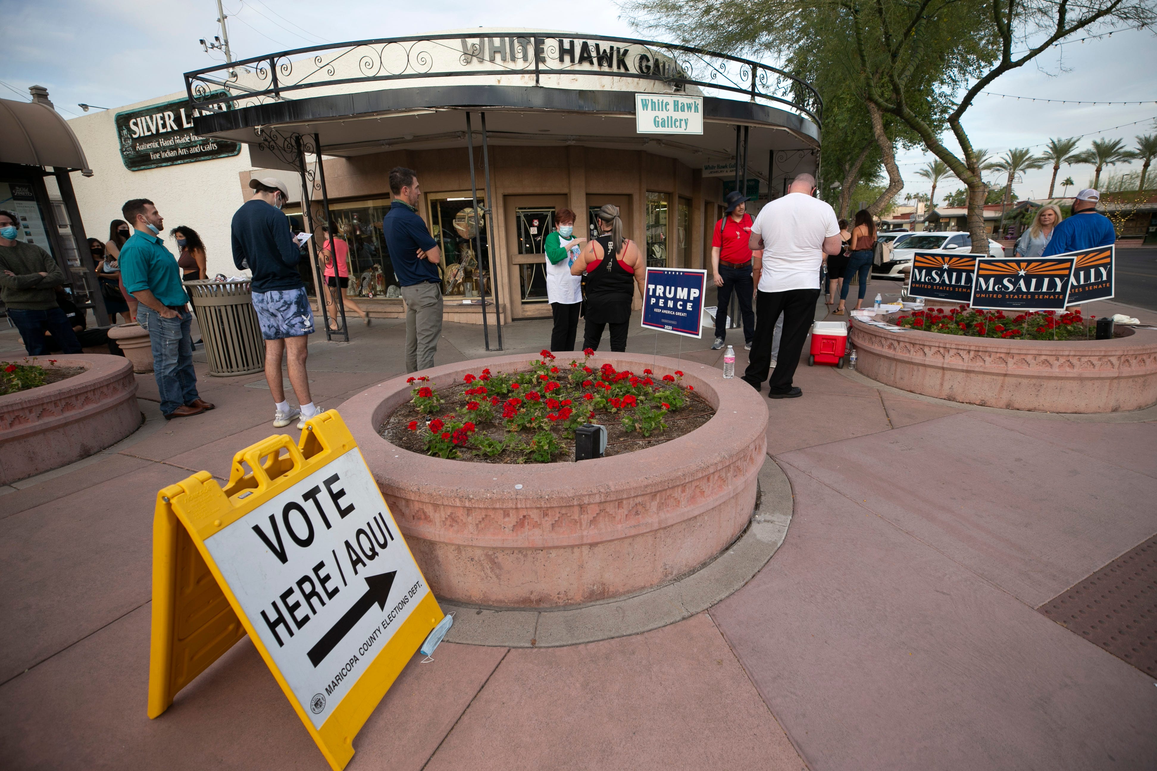 Voters wait in line at the polling place at Mini Social in old town Scottsdale on Election Day on Nov. 3, 2020. Voters said they waited over about an hour to vote. 