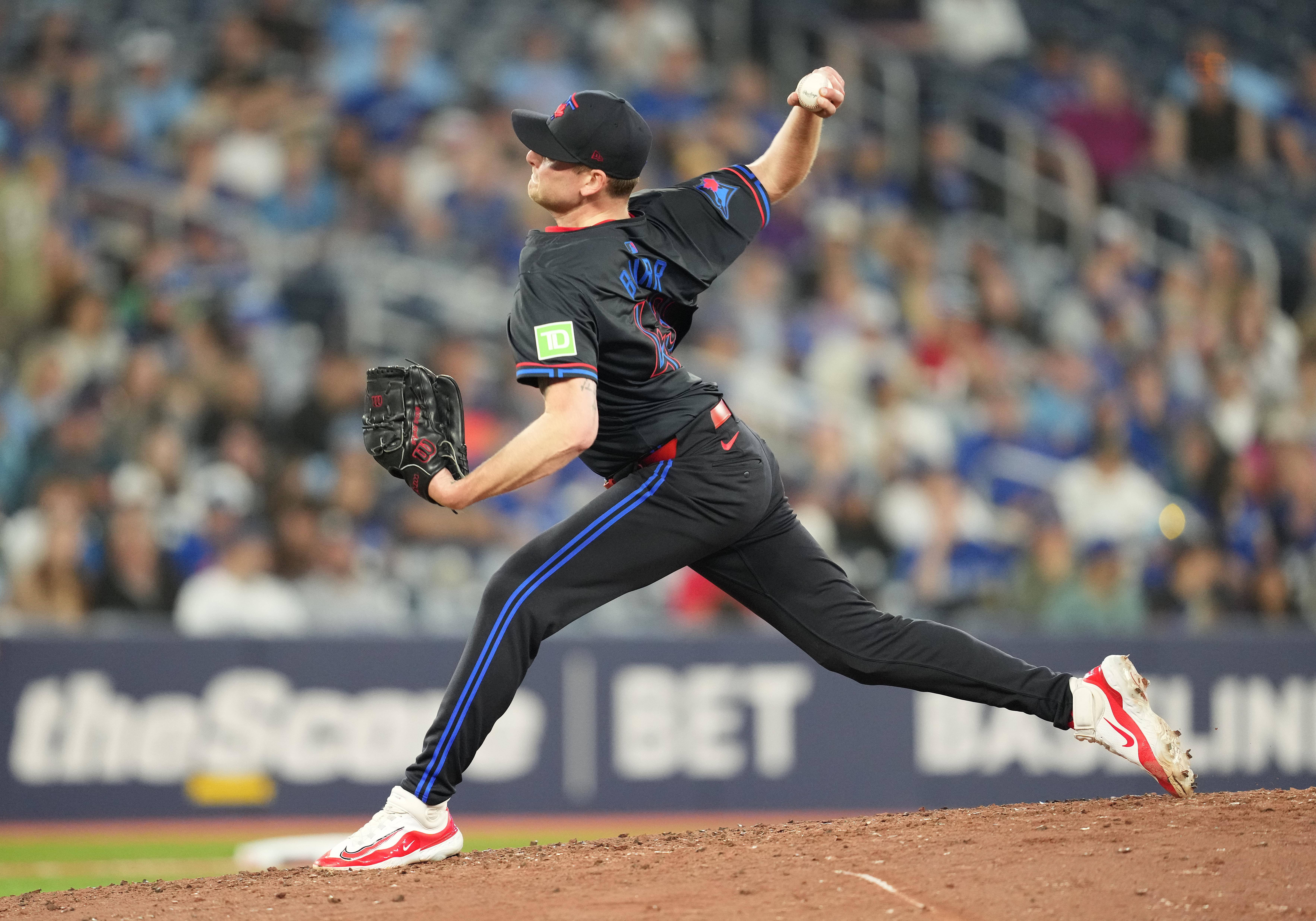 Toronto Blue Jays relief pitcher Ryan Burr throws a pitch as we look at Canadian sportsbook advertising
