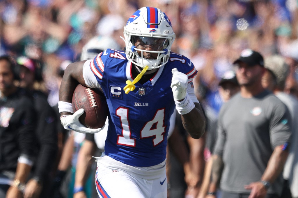 Stefon Diggs of the Buffalo Bills runs with a reception for a touchdown against the Miami Dolphins, and we offer new U.S. bettors our exclusive Caesars promo code for Bills vs. Chargers.