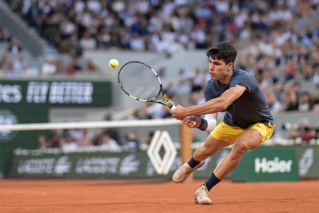 Spain's Carlos Alcaraz Garfia plays a backhand return as we look at the latest 2024 French Open odds.