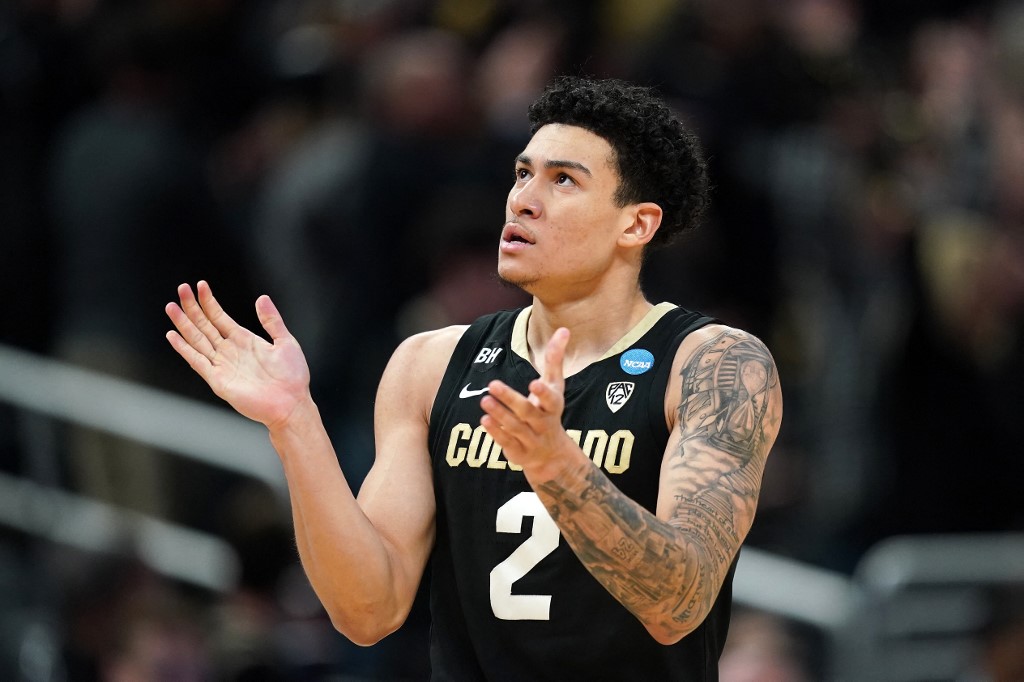KJ Simpson of the Colorado Buffaloes celebrates a basket against the Marquette Golden Eagles.