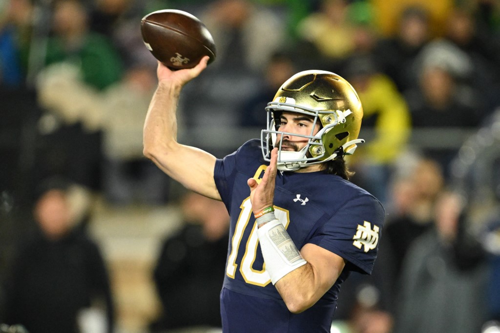 Sam Hartman #10 of the Notre Dame Fighting Irish passes as we make our Senior Bowl picks and prediction ahead of Saturday's showcase.