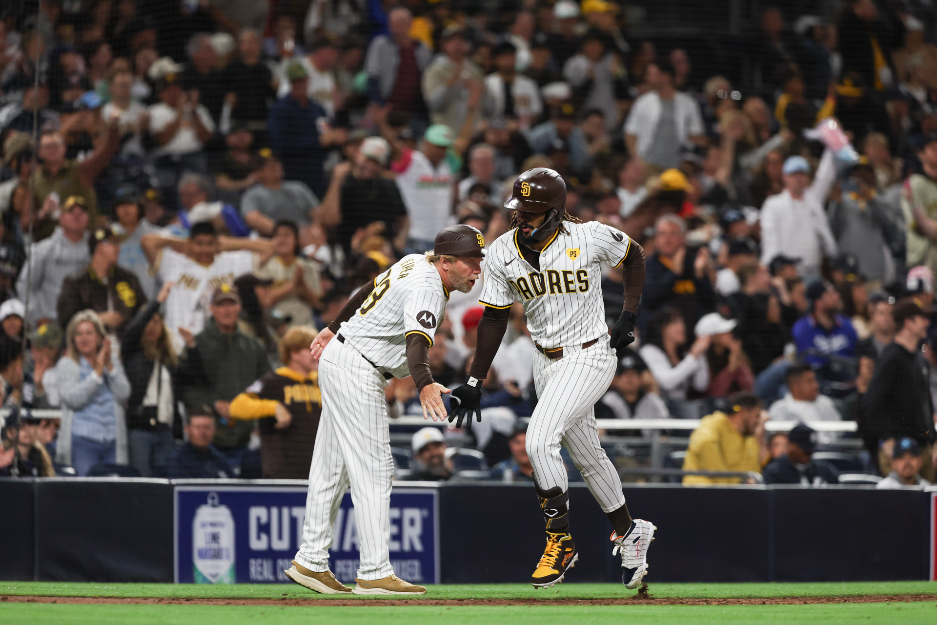 San Diego Padres right fielder Fernando Tatis Jr. high-fives third base coach Tim Leiper after hitting a solo home run against the New York Yankees, and we offer our top MLB player props and expert picks based on the best MLB odds.