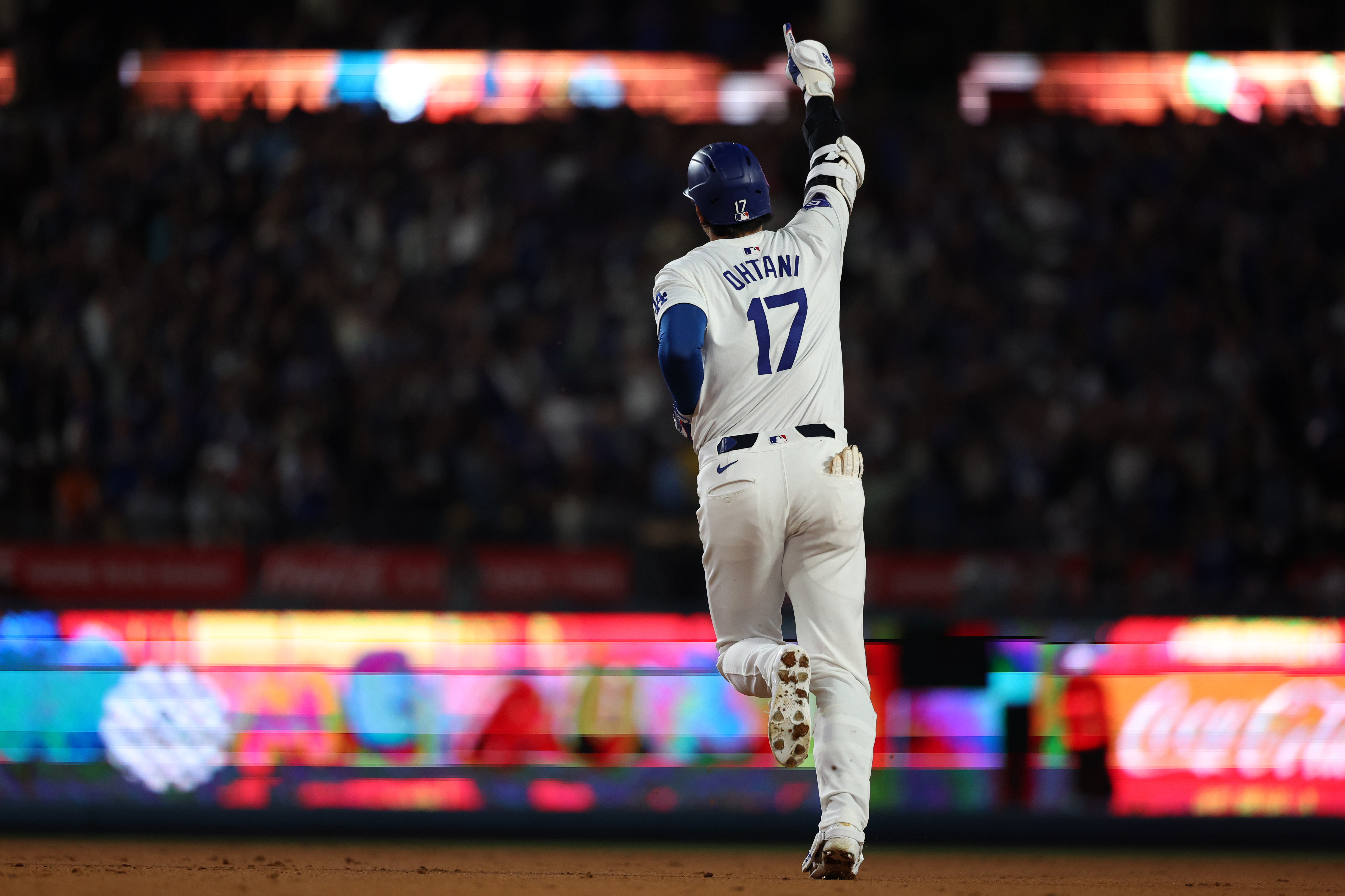 Los Angeles Dodgers designated hitter Shohei Ohtani reacts after hitting a two-run home run during the seventh inning against the Arizona Diamondbacks at Dodger Stadium. We're backing Ohtani in our Home Run Props & Odds.