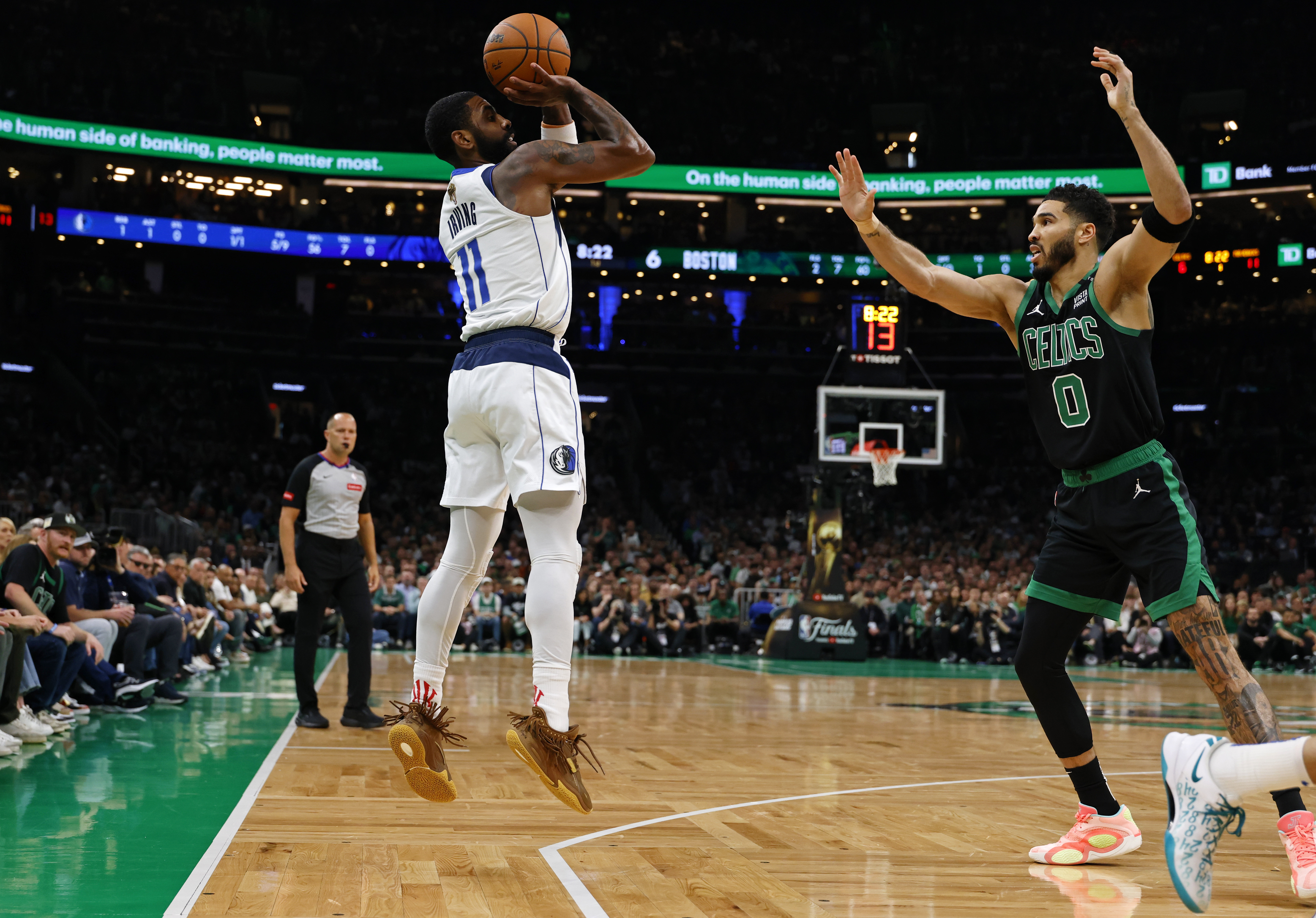 Dallas Mavericks guard Kyrie Irving shoots the ball against Boston Celtics forward Jayson Tatum during the first quarter of Game 2 of the 2024 NBA Finals at TD Garden. We're fading Irving in our Celtics vs. Mavericks Player Props.