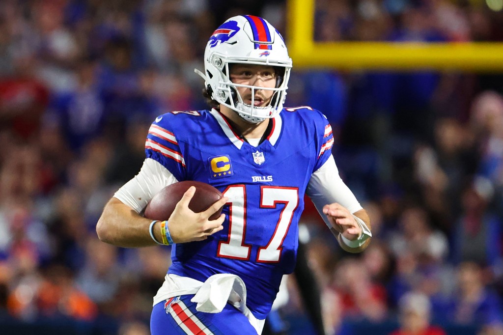 Josh Allen of the Buffalo Bills carries the ball against the Tampa Bay Buccaneers during the third quarter of the game at Highmark Stadium as we look at our Broncos-Bills prediction.