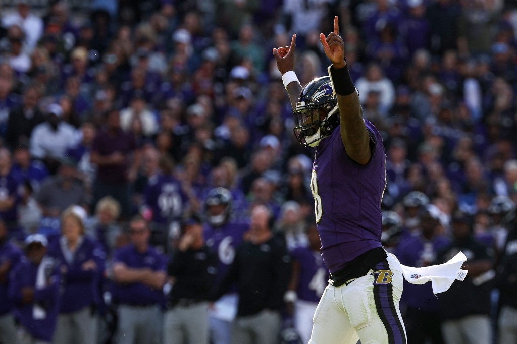 Quarterback Lamar Jackson of the Baltimore Ravens celebrates a touchdown against the Seattle Seahawks, and we offer new U.S. bettors our exclusive bet365 bonus code.