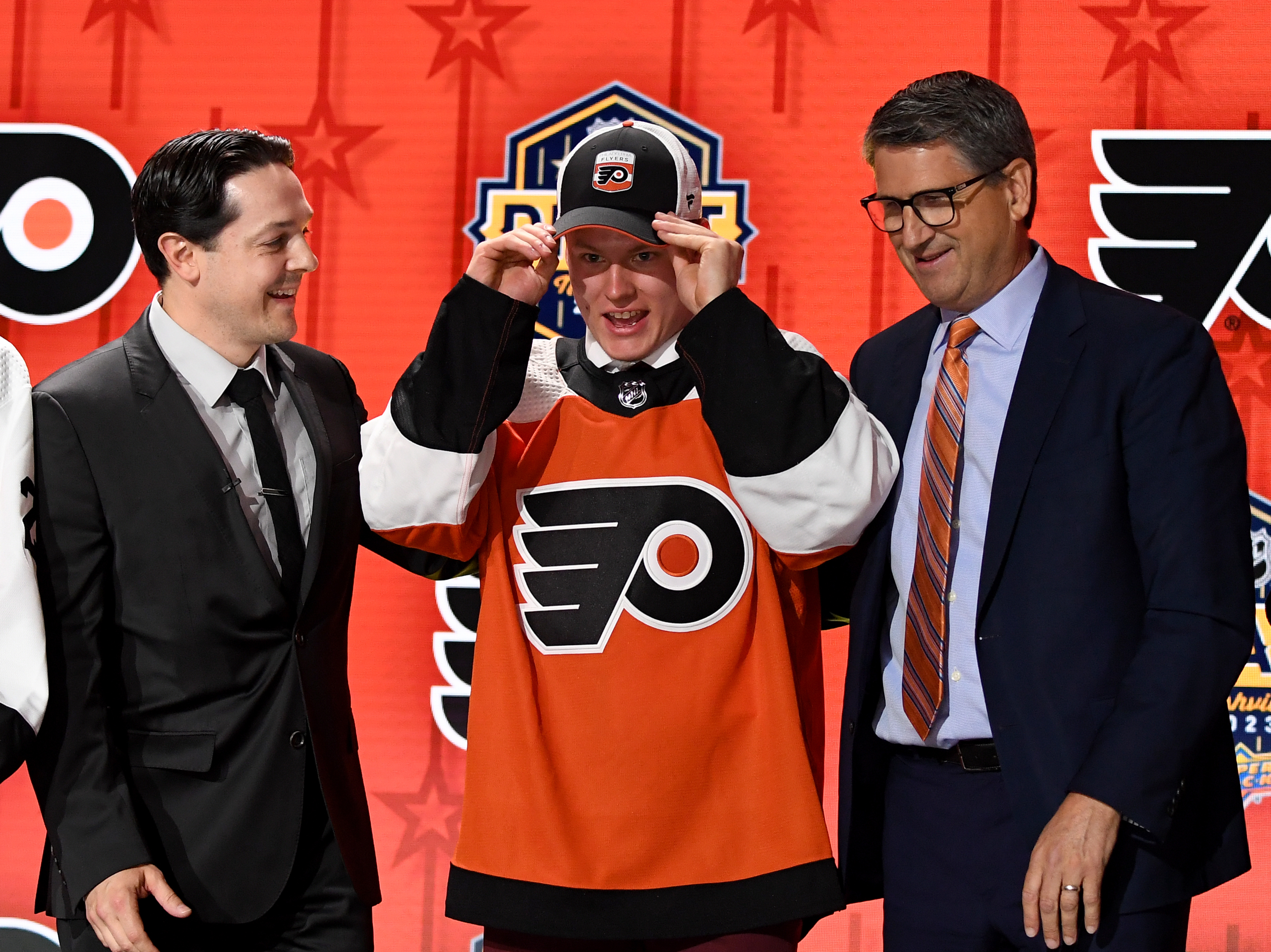 Philadelphia Flyers draft pick Matvei Michkov puts on his hat as we look at the 2025 NHL Calder Trophy odds