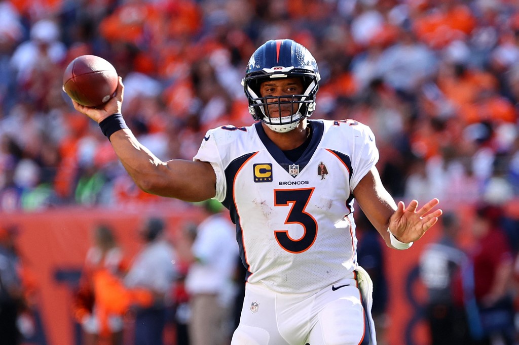 Russell Wilson of the Denver Broncos attempts a pass during the third quarter against the Washington Commanders, and we offer our top Vikings vs. Broncos predictions based on the best NFL odds.