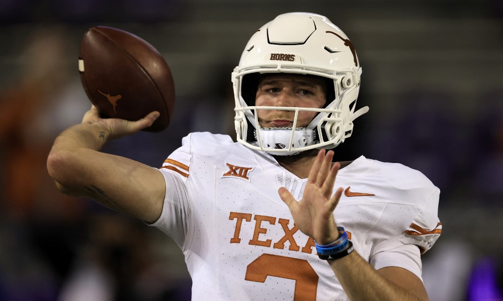 Quinn Ewers of the Texas Longhorns warms up before playing against the TCU Horned Frogs at Amon G. Carter Stadium on Nov. 11 as we look at our Oklahoma State-Texas prediction.