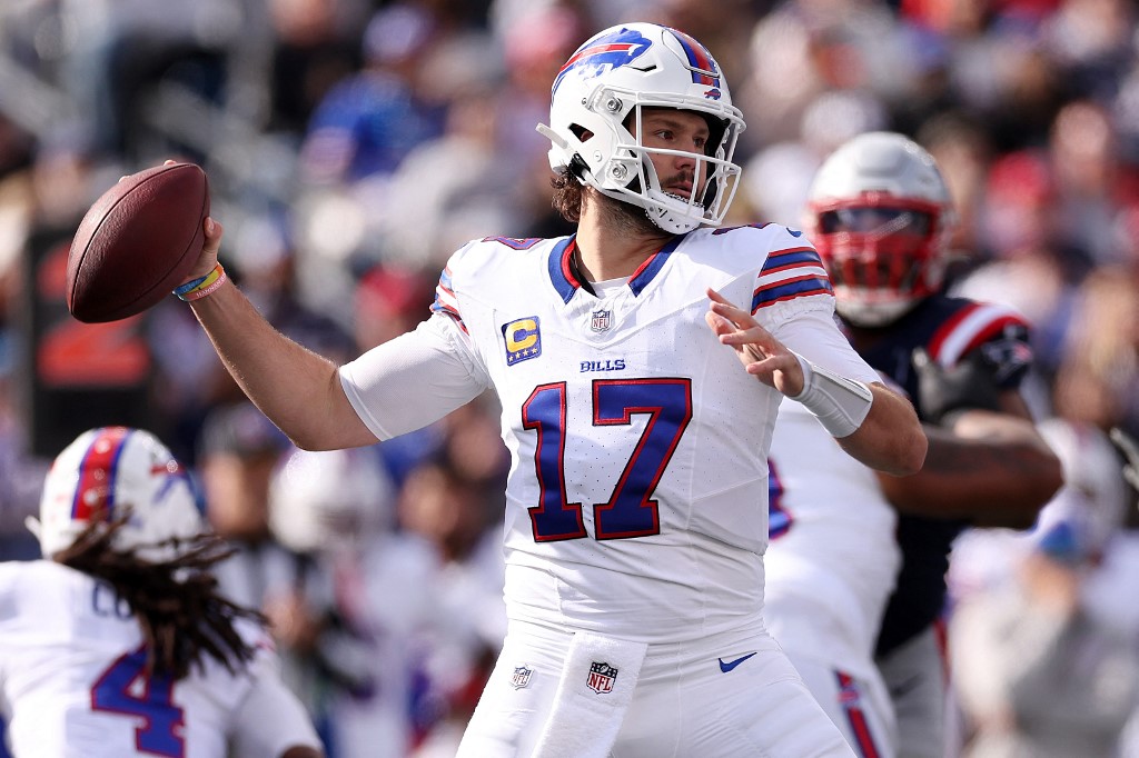 Buffalo Bills QB Josh Allen attempts a pass as part of Week 9 NFL predictions for Sunday Night Football between the Bills vs. Bengals