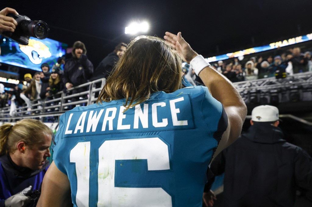 Trevor Lawrence of the Jacksonville Jaguars walks off the field as we look at our top Jaguars vs. Bengals bonus code.