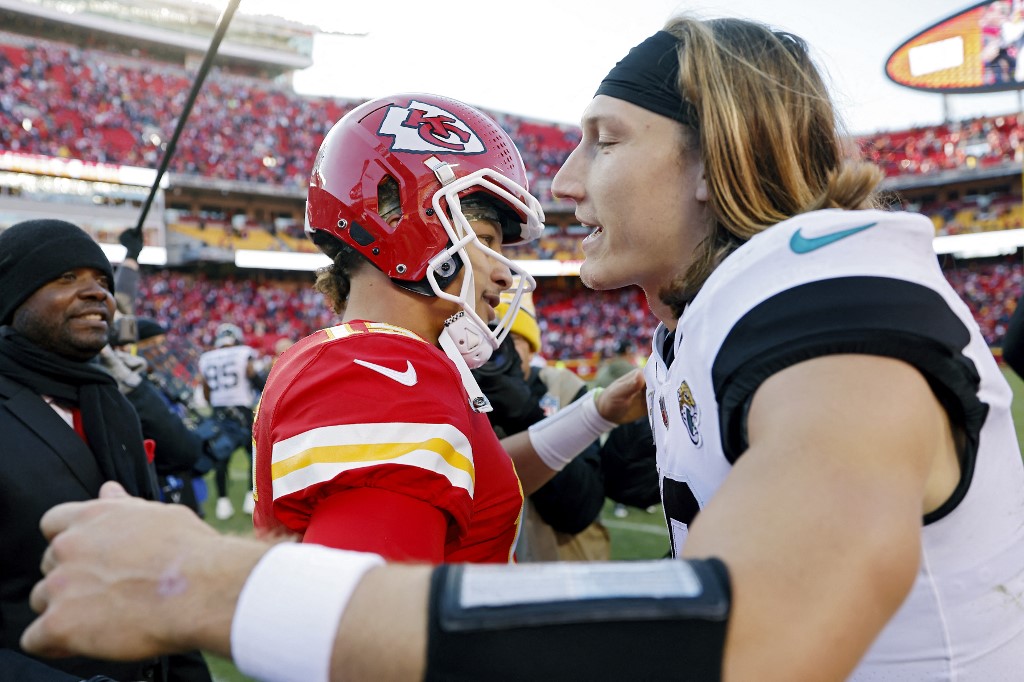 Patrick Mahomes #15 of the Kansas City Chiefs hugs Trevor Lawrence #16 of the Jacksonville Jaguars after the Chiefs defeated the Jaguars 27-17 at Arrowhead Stadium on November 13, 2022 in Kansas City, Missouri.