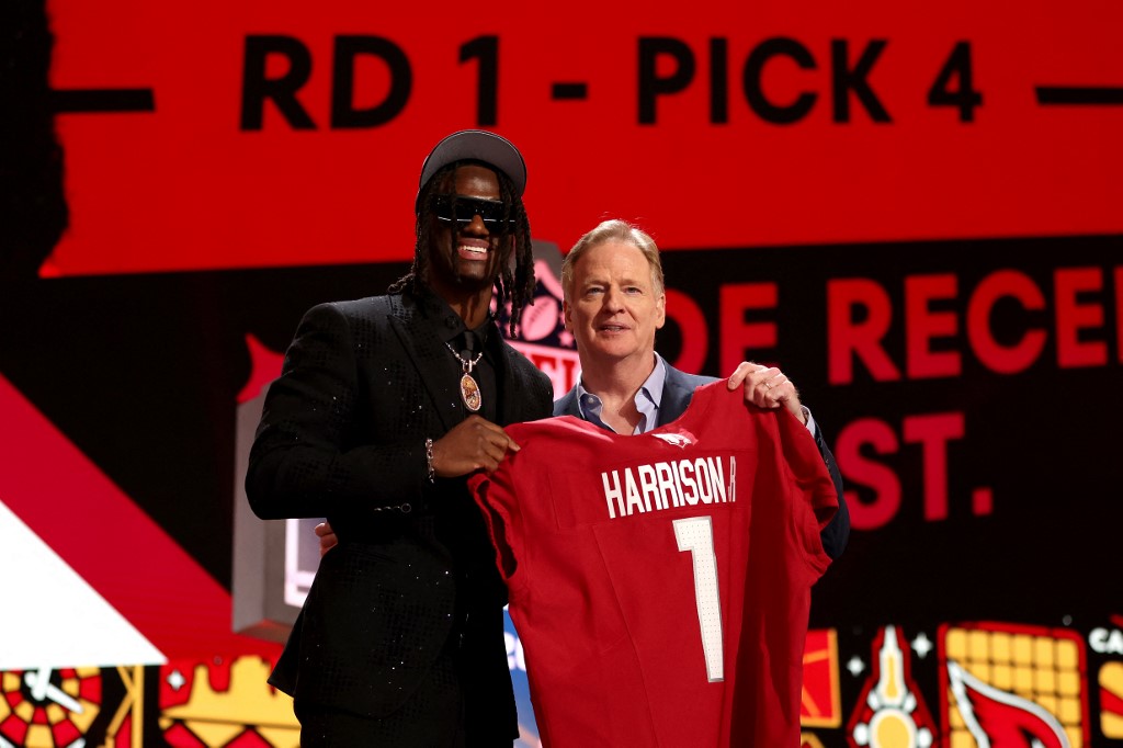 Marvin Harrison Jr. poses with NFL Commissioner Roger Goodell, as we examine the best 2024 NFL rookie receiving leader odds and predictions.