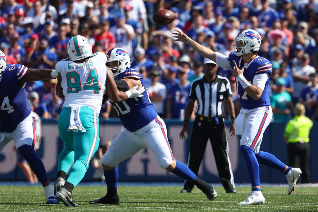 Josh Allen #17 of the Buffalo Bills passes the ball against the Miami Dolphins as we make our Week 18 NFL player props predictions and picks ahead of Sunday Night Football to cap off the 2023 NFL regular season.