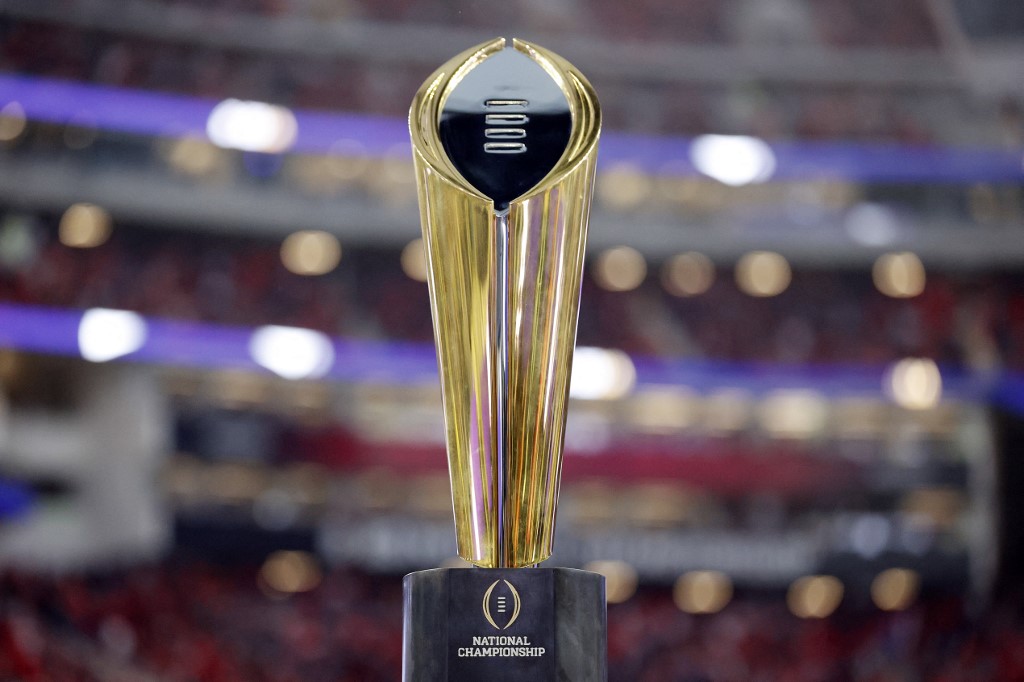 The College Football Playoff National Championship trophy is displayed as we look at the college football bowl odds and info for 2023