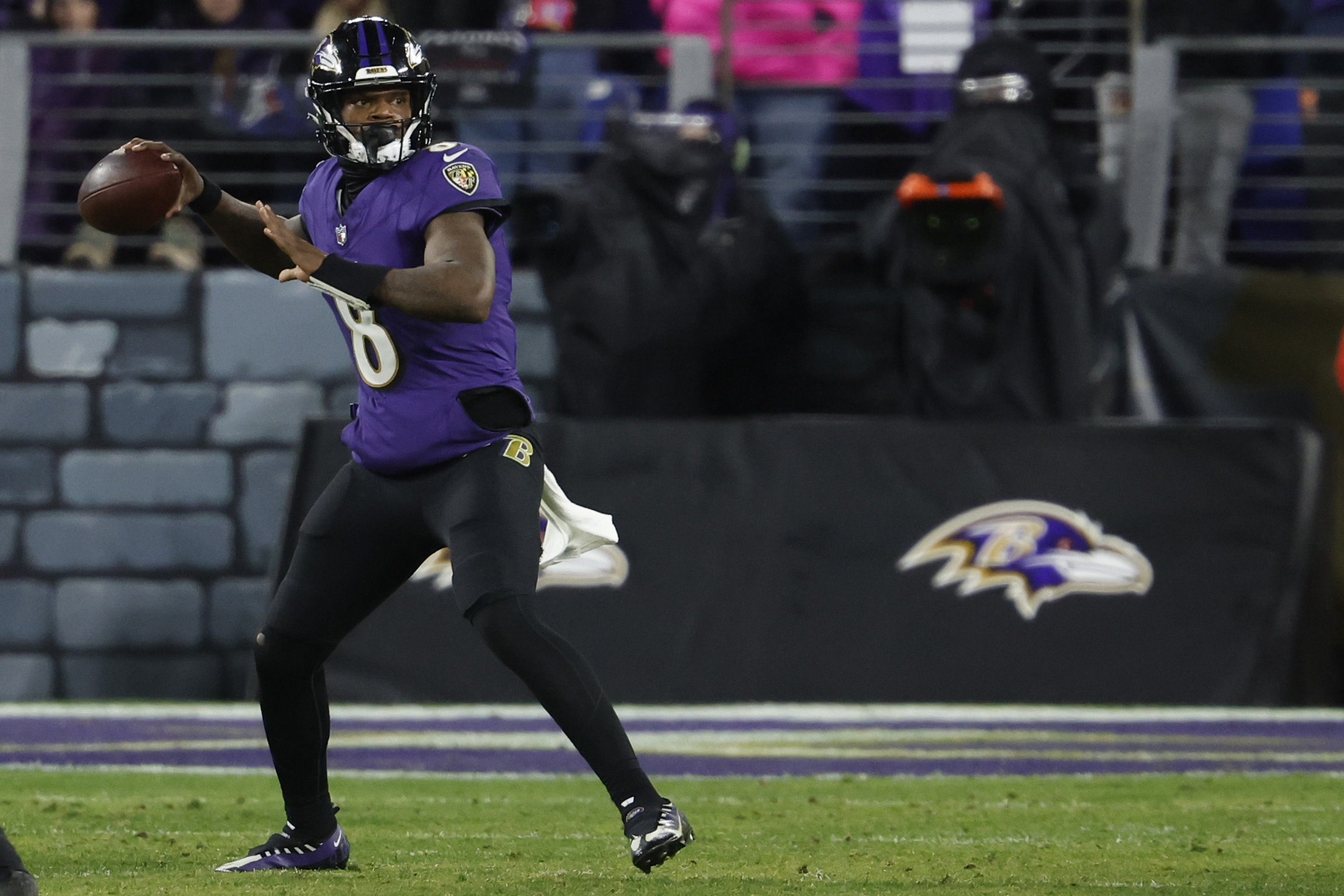 Baltimore Ravens quarterback Lamar Jackson passes the ball as we look at the merchandise deal between the Ravens and Fanatics.