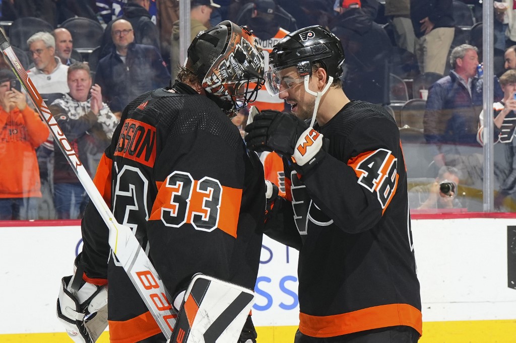 Samuel Ersson #33 of the Philadelphia Flyers celebrates with Morgan Frost #48 as we look at the Pennsylvania sports betting financials for February 2024.