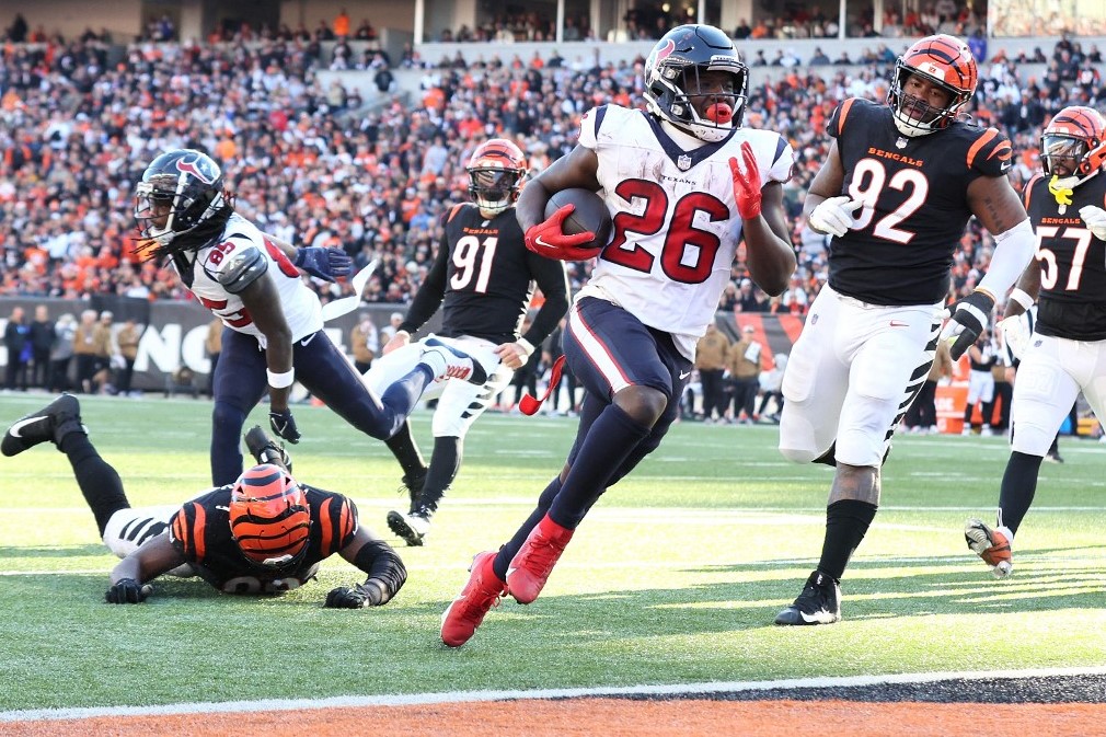 Devin Singletary of the Houston Texans runs in for a touchdown that helped cash a huge SGP at Hard Rock Bet.