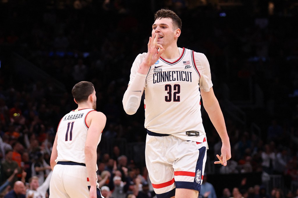 Donovan Clingan #32 of the Connecticut Huskies reacts as we offer our best Alabama vs. UConn player props for the Final Four of the NCAA Tournament on Saturday.