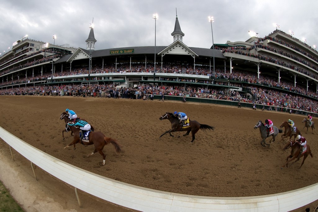Mage, ridden by jockey Javier Castellano leads the field to the finish line during the 149th running of the Kentucky Derby as we look at Circa Underscoreg and its retail plans at Kentucky Downs.