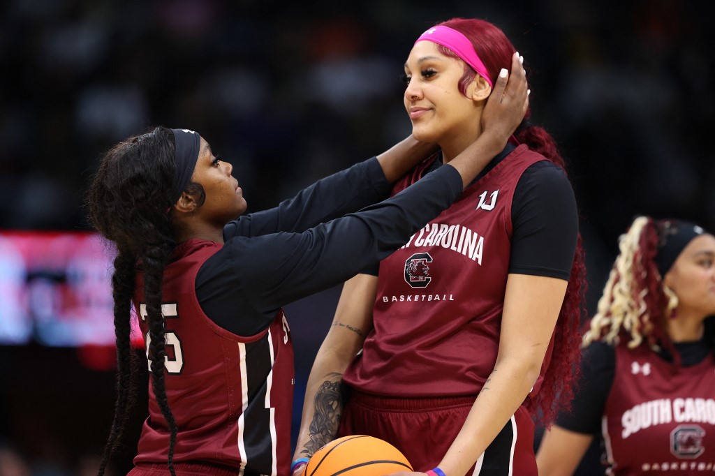 Kamilla Cardoso #10 of the South Carolina Gamecocks looks on with teammate Raven Johnson #250 as we make our best National Championship, featuring South Carolina and Iowa, prop picks.