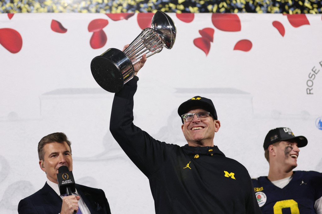 Head coach Jim Harbaugh of the Michigan Wolverines celebrates as we round up our college football championship predictions.