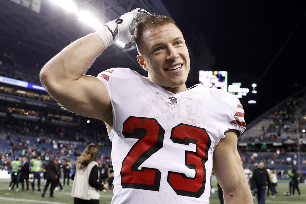 Christian McCaffrey of the San Francisco 49ers reacts after beating the Seattle Seahawks at Lumen Field as we look at our NFC West betting picks.