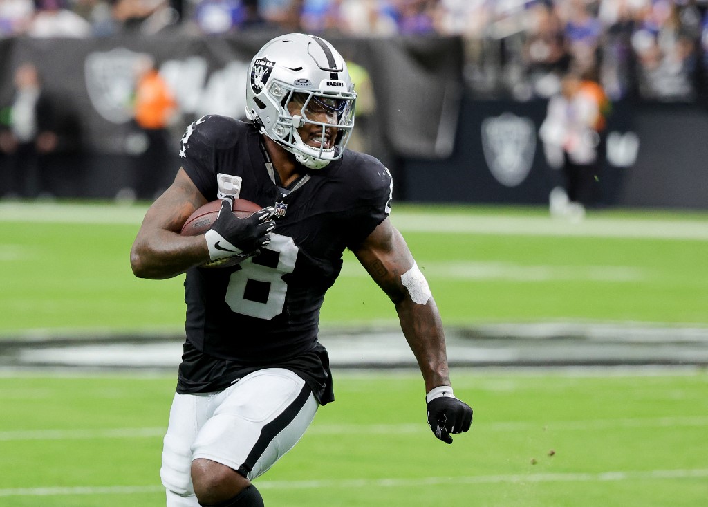 Running back Josh Jacobs of the Las Vegas Raiders rushes the ball as part of our Week 10 Jets vs. Raiders NFL predictions
