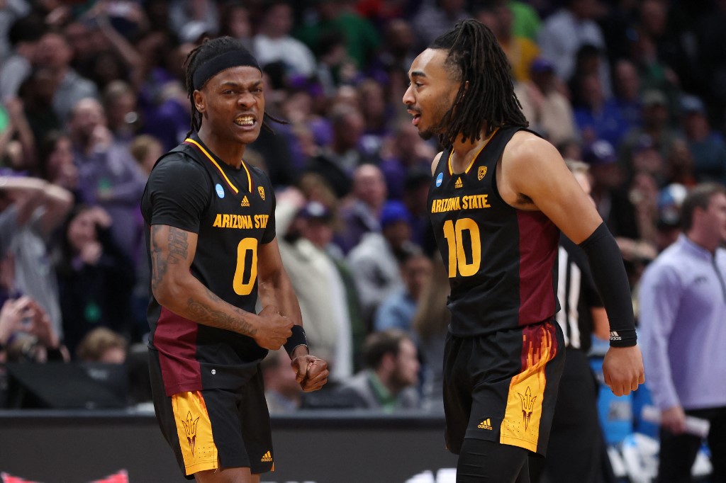 DJ Horne #0 and Frankie Collins #10 of the Arizona State Sun Devils react after the game tying three point basket against the TCU Horned Frogs during the second half in the first round of the NCAA Men's Basketball Tournament on March 17.