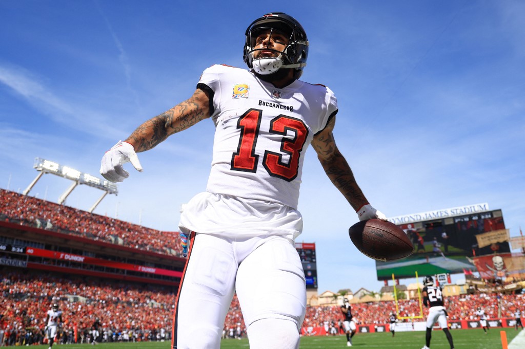 Mike Evans #13 of the Tampa Bay Buccaneers looks on after scoring a touchdown as we look at our our Week 10 NFL predictions and first touchdown scorers