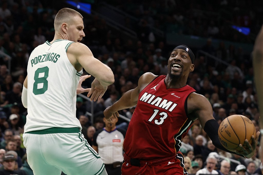 Bam Adebayo of the Miami Heat looks to go past Kristaps Porzingis of the Boston Celtics during the first quarter of Game 1, and we're offering our top Celtics vs. Heat player props and expert picks based on the best NBA odds.
