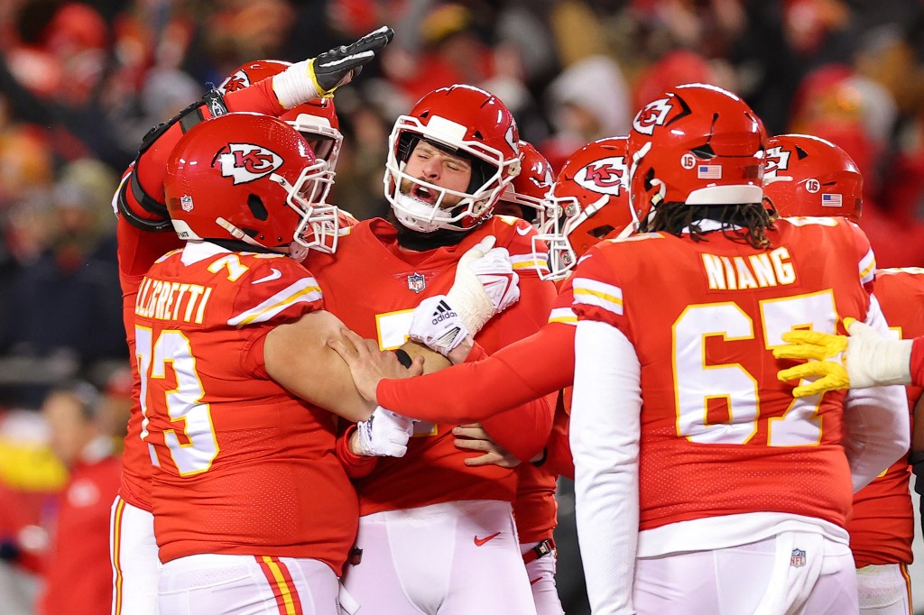 Harrison Butker of the Kansas City Chiefs celebrates with teammates as we share our best Chiefs vs. Ravens prediction.