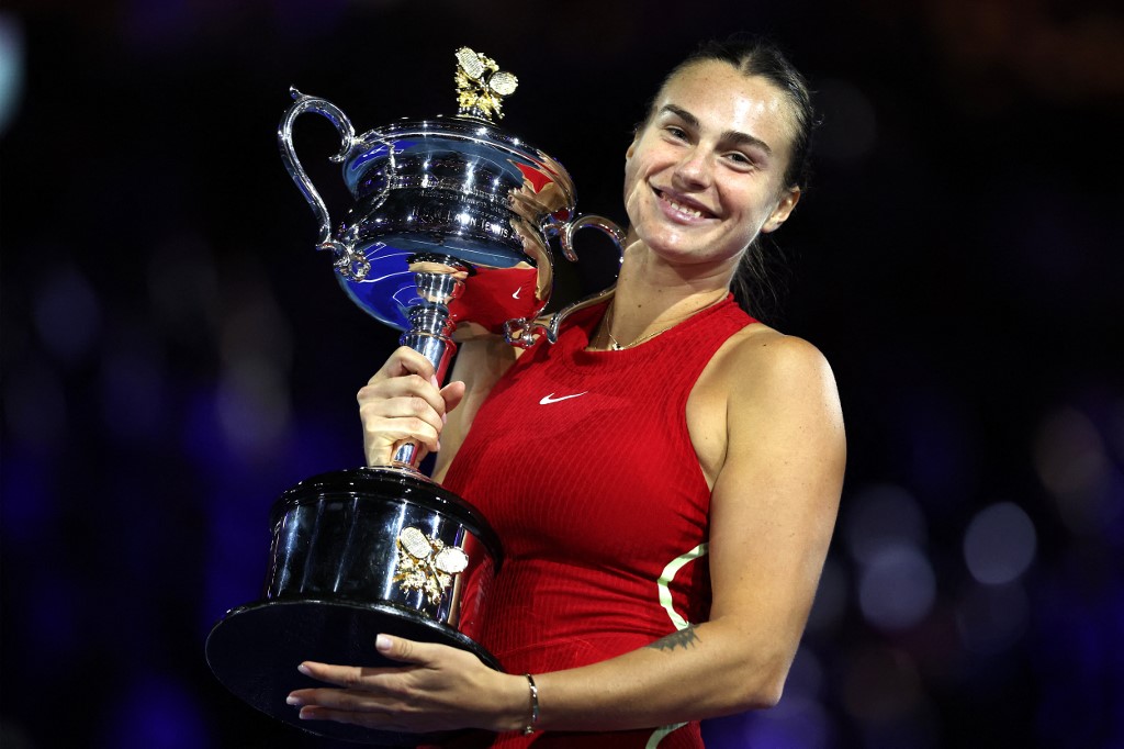 Belarus' Aryna Sabalenka celebrates with the Daphne Akhurst Memorial Cup