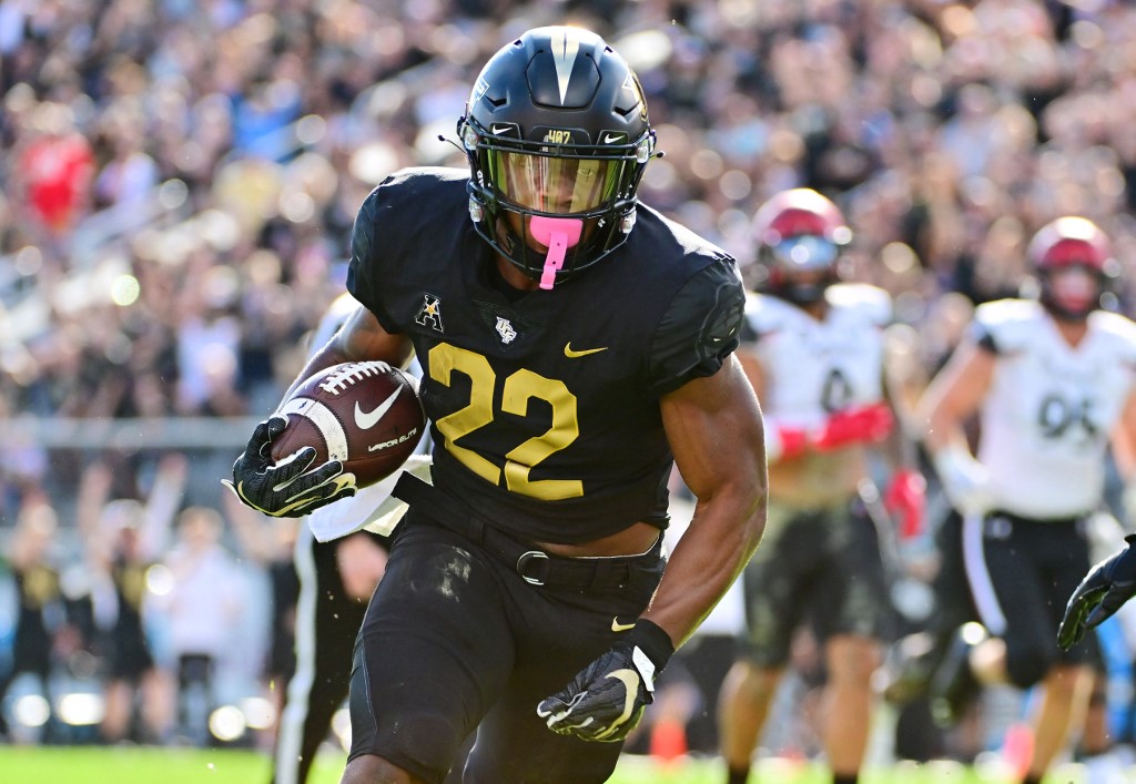 RJ Harvey of the UCF Knights runs in a 26-yard touchdown as we look our top Georgia Tech vs. UCF bonus code.