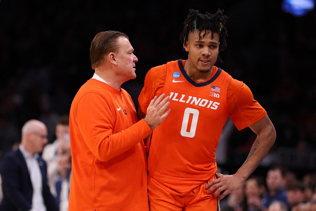 Head coach Brad Underwood of the Illinois Fighting Illini hugs Terrence Shannon Jr. as we look at Fanatics Underscoregs launch in Illinois