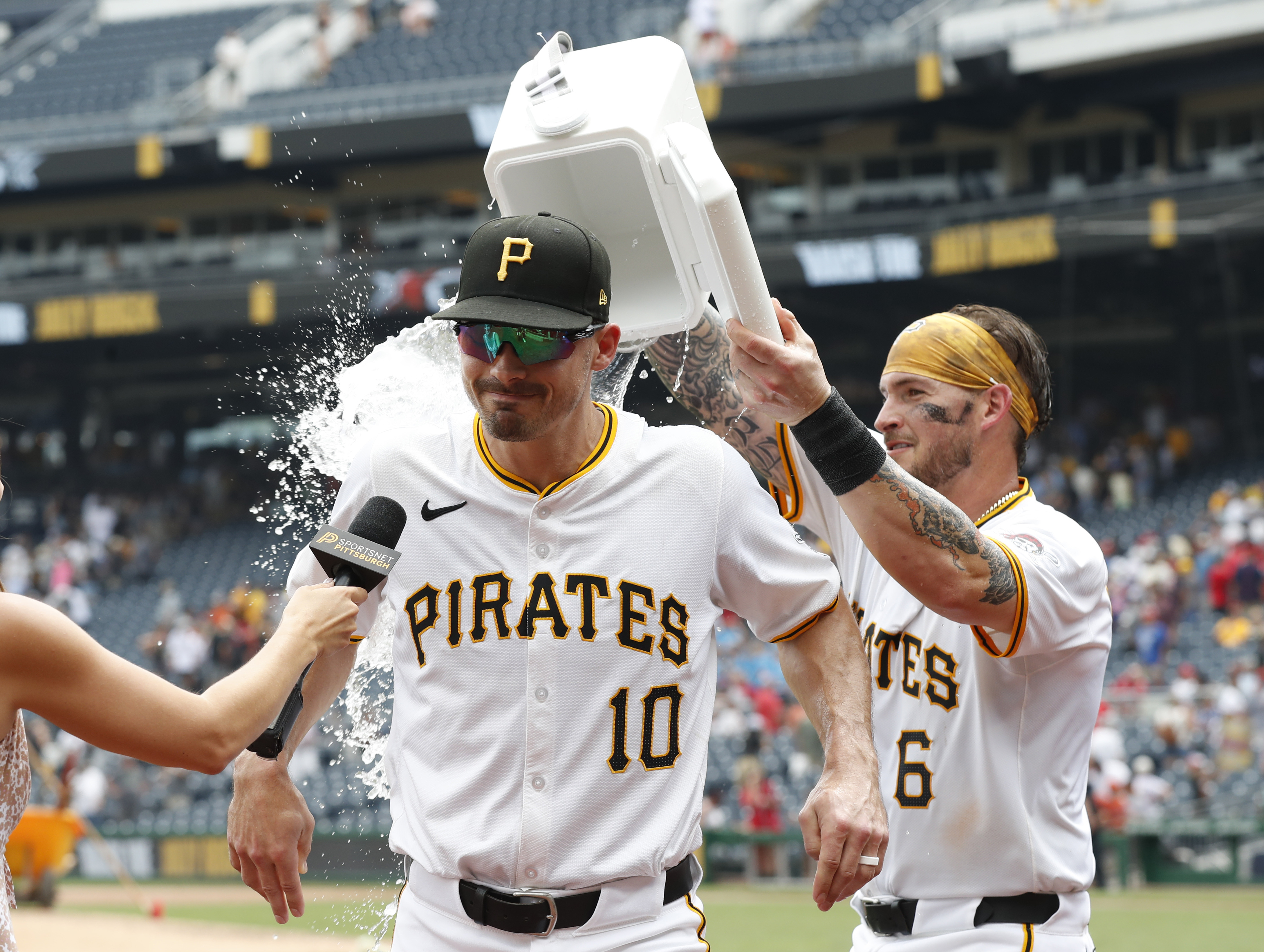Pittsburgh Pirates catcher Yasmani Grandal dumps water on left fielder Bryan Reynolds as we look at the 2024 May sports betting financials for Pennsylvania