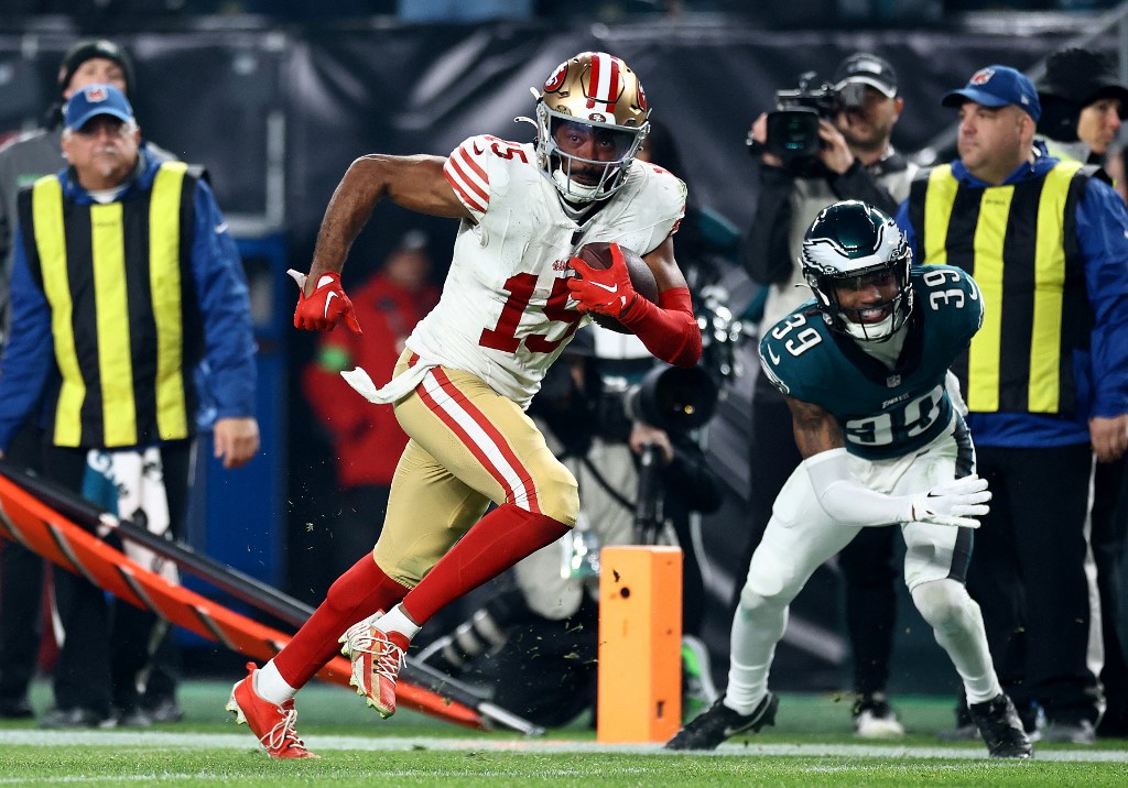 Jauan Jennings #15 of the San Francisco 49ers scores a touchdown as we look at the best Chiefs vs. 49ers NFL player props