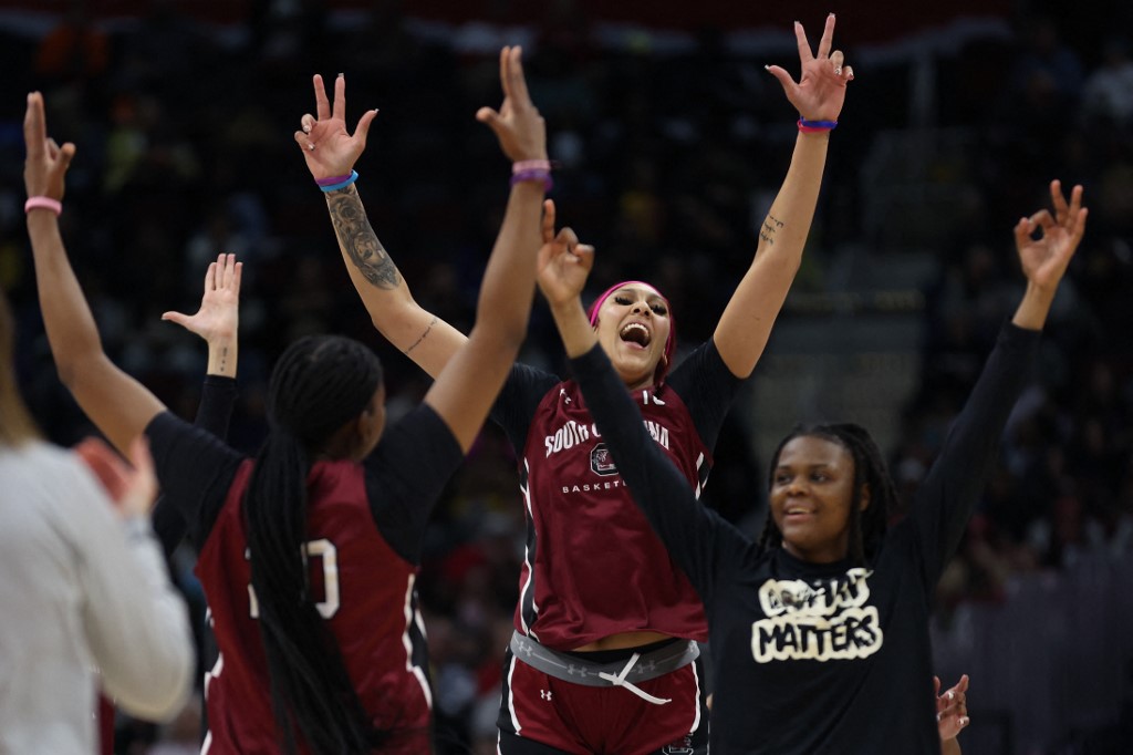 Kamilla Cardoso #10 of the South Carolina Gamecocks reacts with teammates as we look at our BetMGM bonus code for Iowa vs. South Carolina