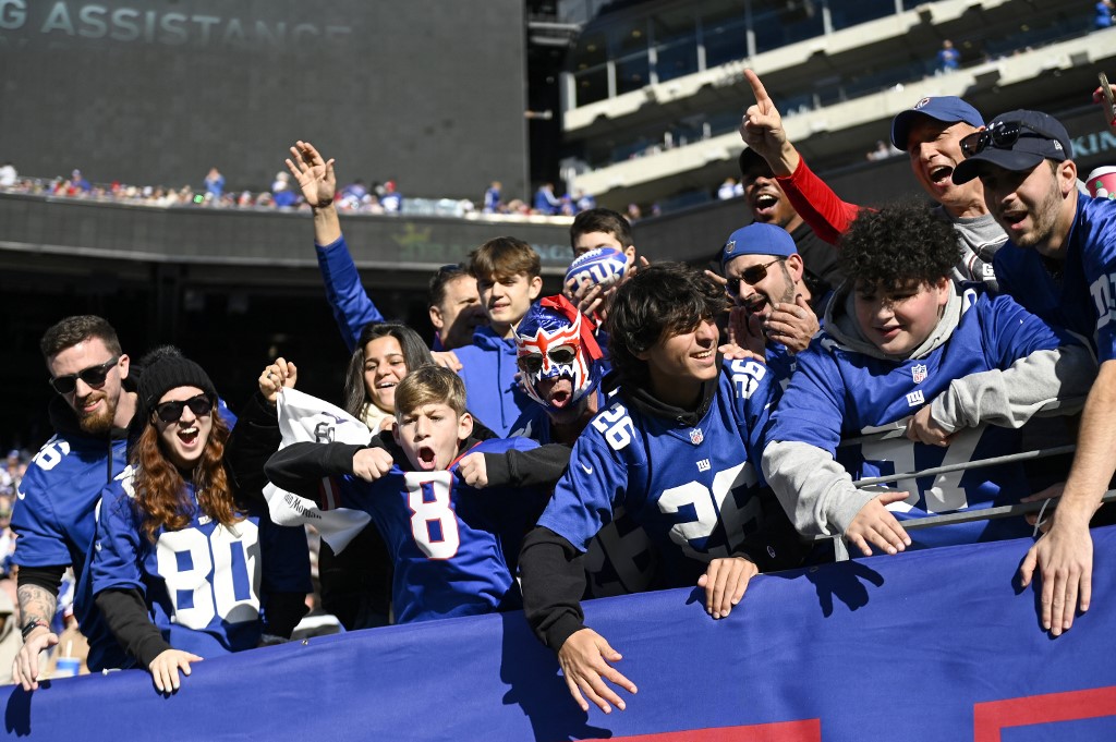 New York Giants fans cheer prior to a game as we look into the huge month of sports betting for New York in September.