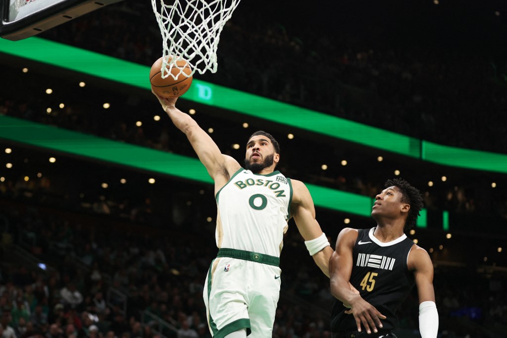 Jayson Tatum #0 of the Boston Celtics dunks the ball as we look at the best Super Bowl cross-sport bets for Sunday