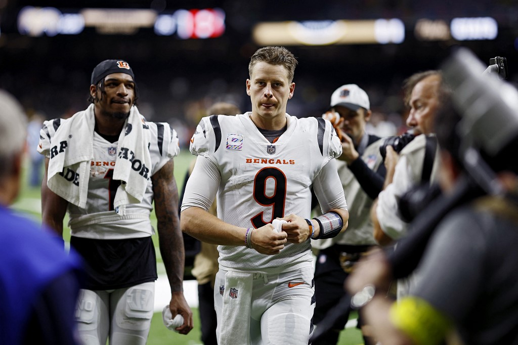 Joe Burrow and Ja'Marr Chase of the Cincinnati Bengals walk off the field after defeating the New Orleans Saints at Caesars Superdome in New Orleans, Louisiana. Photo by Chris Graythen/Getty Images via AFP.