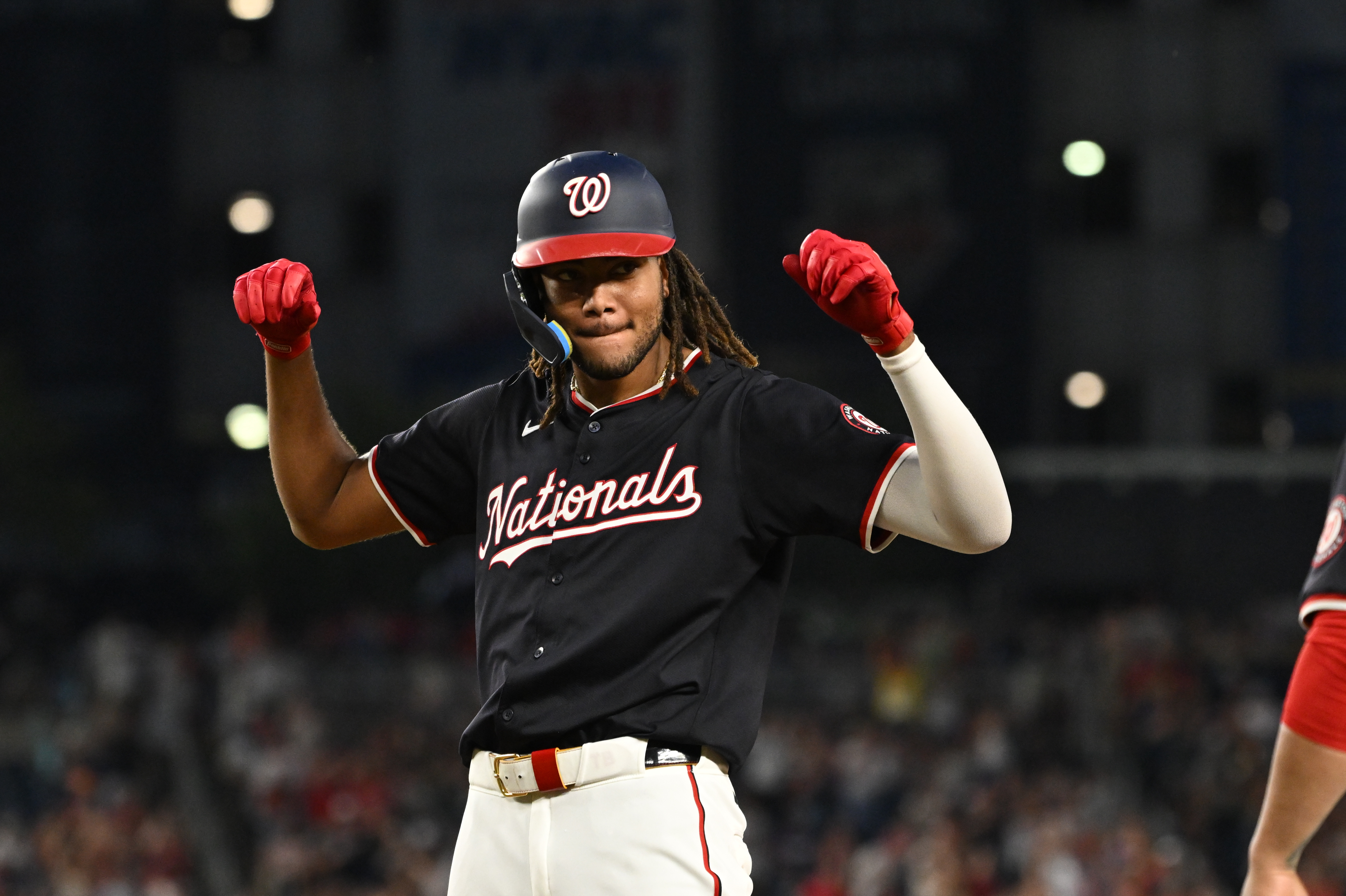 Washington Nationals center fielder James Wood (50) celebrates as we explore the Washington D.C. sports betting revenue reports for May.