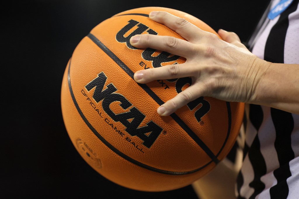 The NCAA logo is seen on the game ball as we look at a potential nationwide ban on college player prop betting.