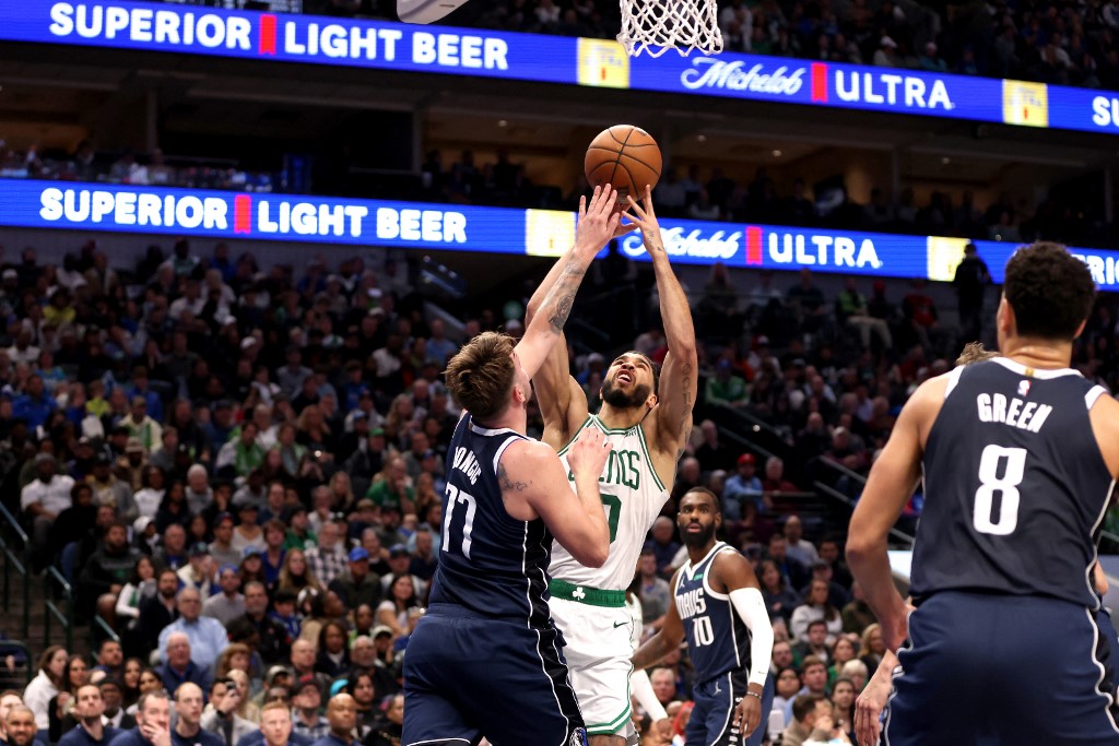 Jayson Tatum (0) of the Boston Celtics shoots the ball against Luka Doncic (77) of the Dallas Mavericks, as we offer our NBA Finals MVP predictions and power rankings to win the award ahead of the 2024 NBA Finals.